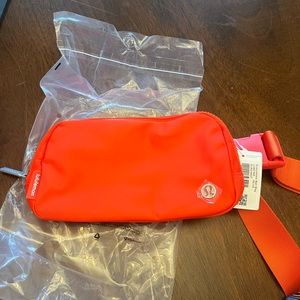 brand new orange lululemon belt bag